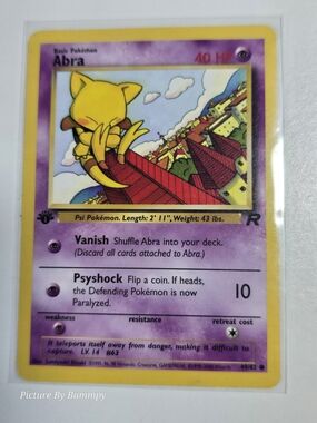 #20 Pokemon 1st Edition Abra card from the Team Rocket set, card number 49/82.